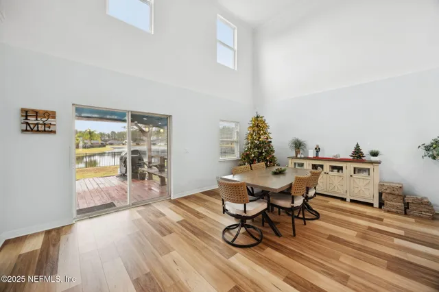 a dining room with a table and chairs