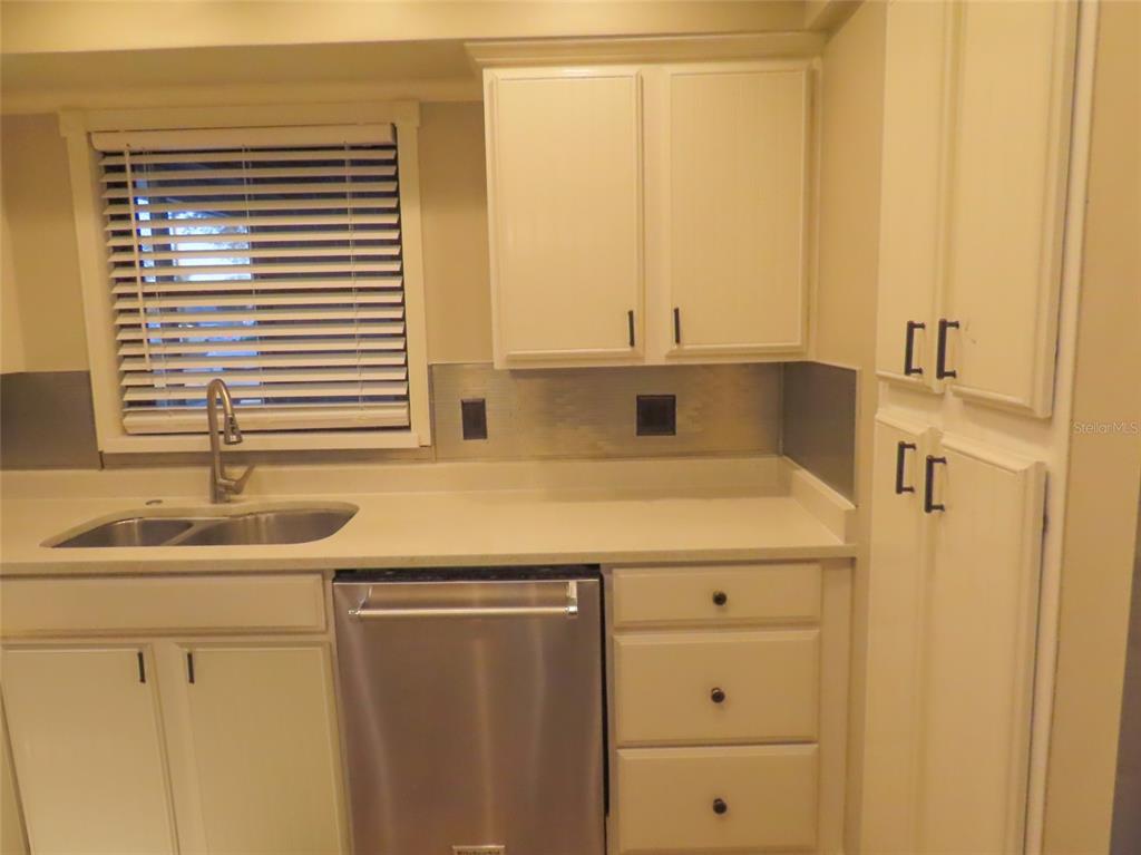 1798 Faulds Road North Clearwater, FL 33756 - Photo 12 of 34 a kitchen with a sink and a window