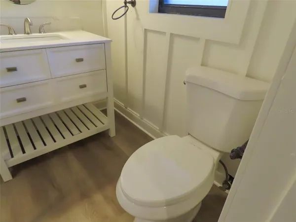 a bathroom with a sink and mirror