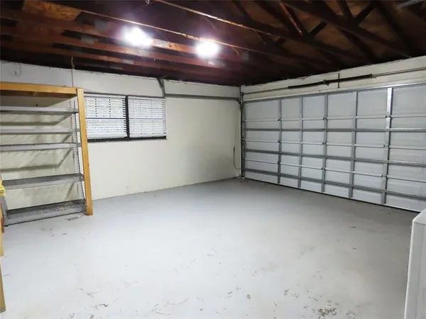 a view of storage and utility room with racks on the wall