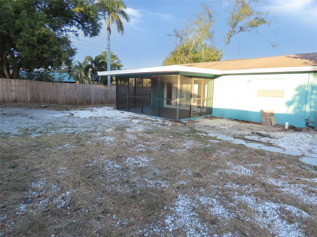 1798 Faulds Road North Clearwater, FL 33756 - Photo 31 of 34 a view of a house with backyard and a tree