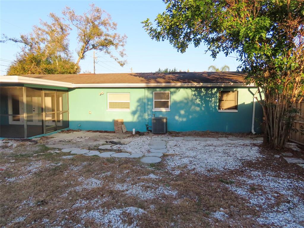 1798 Faulds Road North Clearwater, FL 33756 - Photo 32 of 34 a view of a backyard with a garden and plants