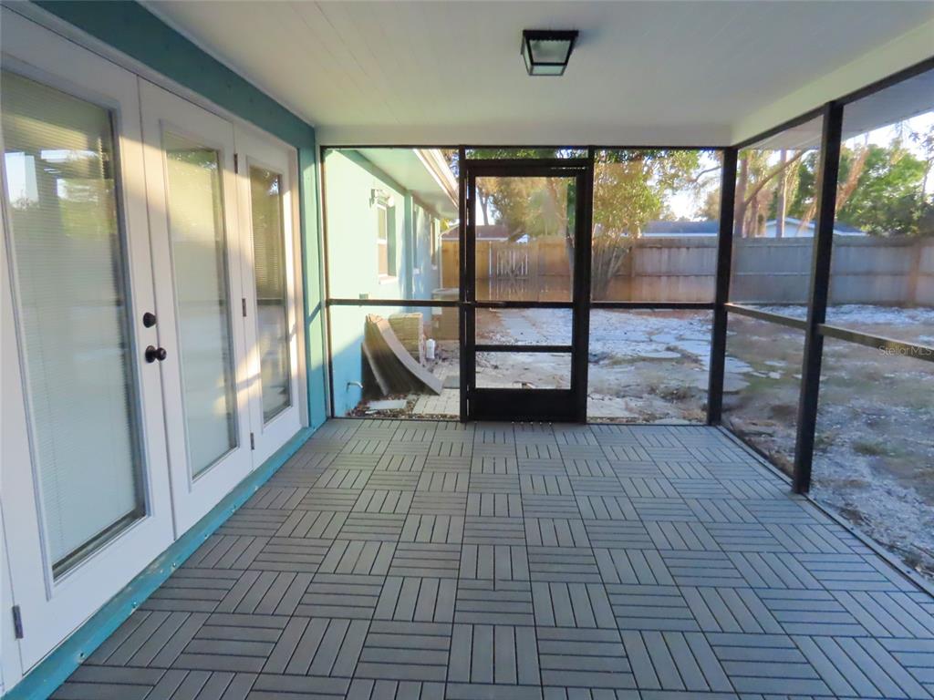 1798 Faulds Road North Clearwater, FL 33756 - Photo 34 of 34 a view of empty room with wooden floor and fan