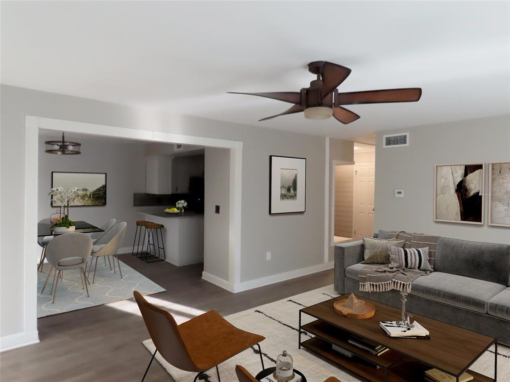 1798 Faulds Road North Clearwater, FL 33756 - Photo 4 of 34 a living room with furniture a rug and a chandelier