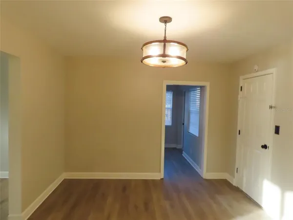 a kitchen with sink and cabinets