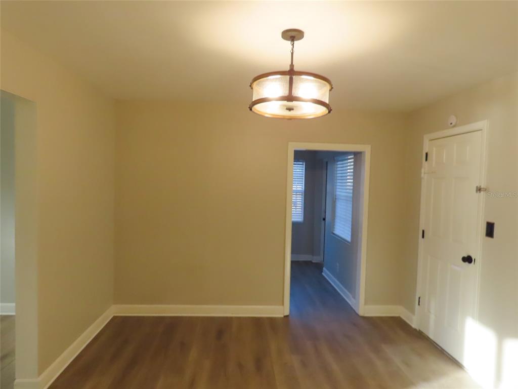 1798 Faulds Road North Clearwater, FL 33756 - Photo 8 of 34 a view of an empty room with wooden floor