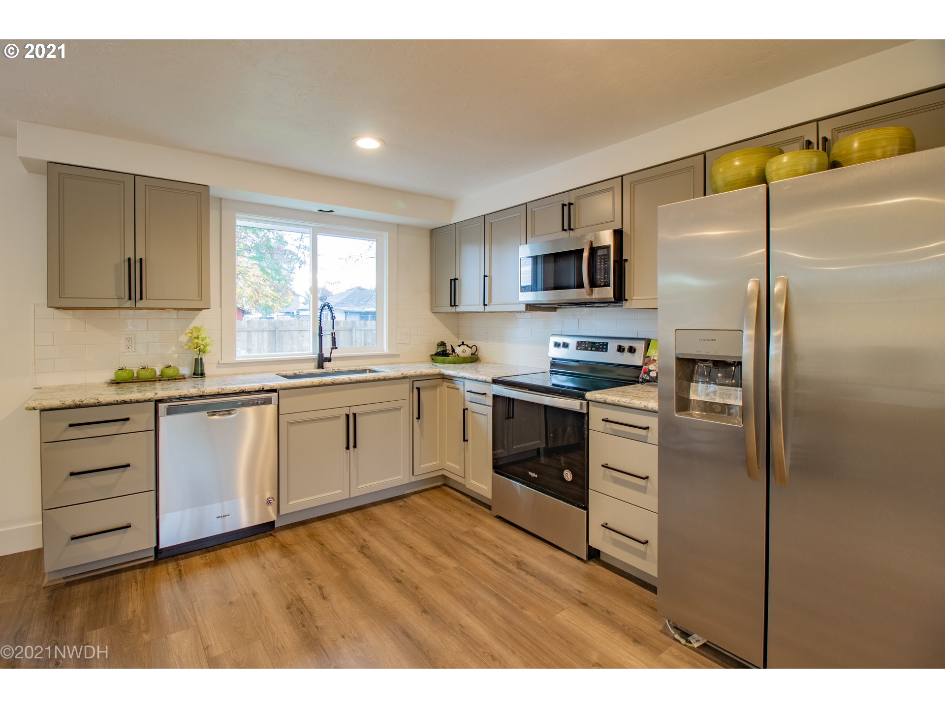 1481 T Street Springfield, OR 97477 - Photo 7 of 21 a kitchen with a refrigerator stove top oven and sink