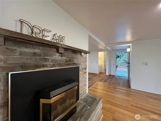 a kitchen with granite countertop stove top oven and cabinets