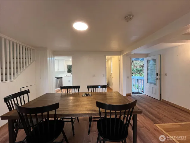 a view of a dining room with furniture and window