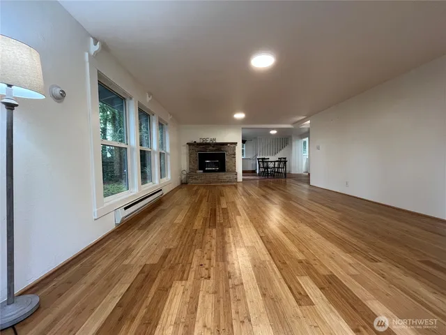 a view of outdoor space with wooden floor and windows