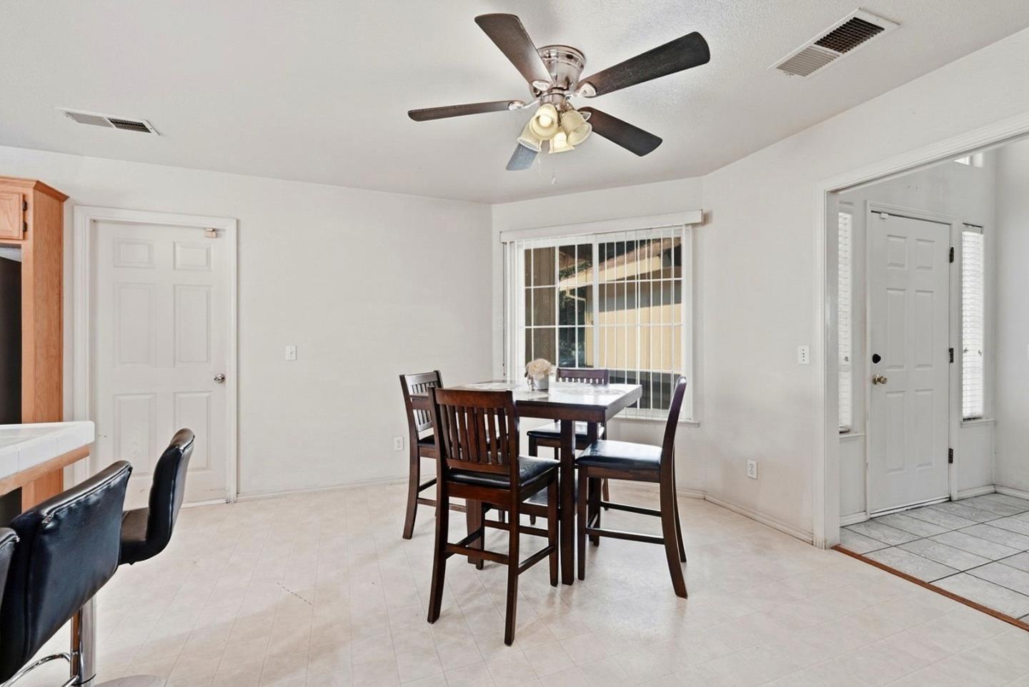 3882 Pintail Court Merced, CA 95340 - Photo 10 of 21 a view of a dining room with furniture