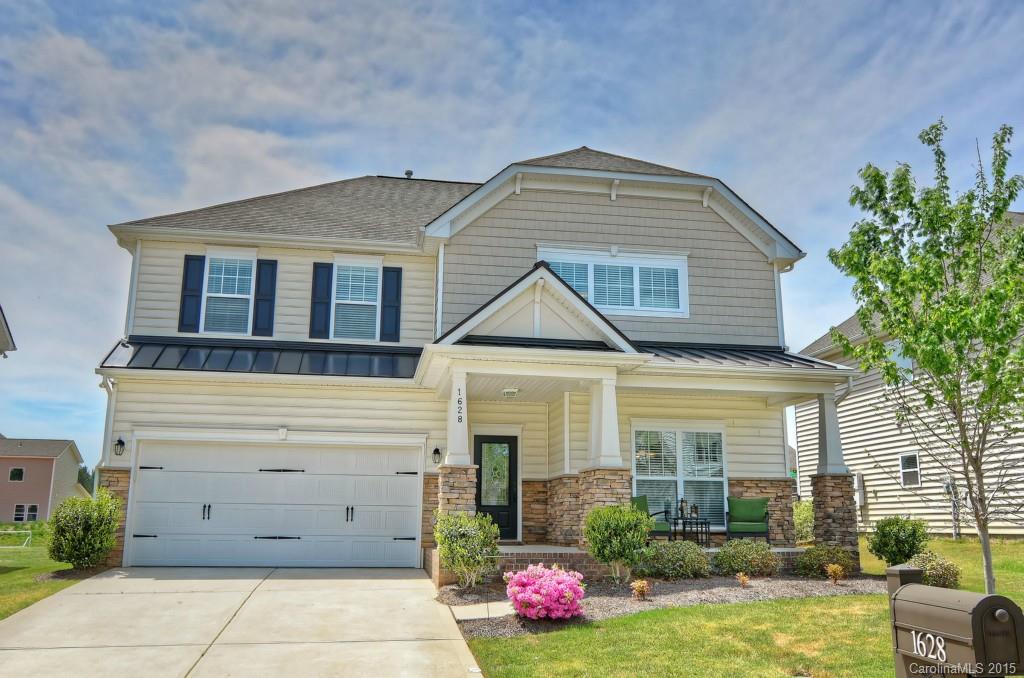 1628 Ridgehaven Road Waxhaw, NC 28173 - Photo 1 of 24 a front view of a house with garden