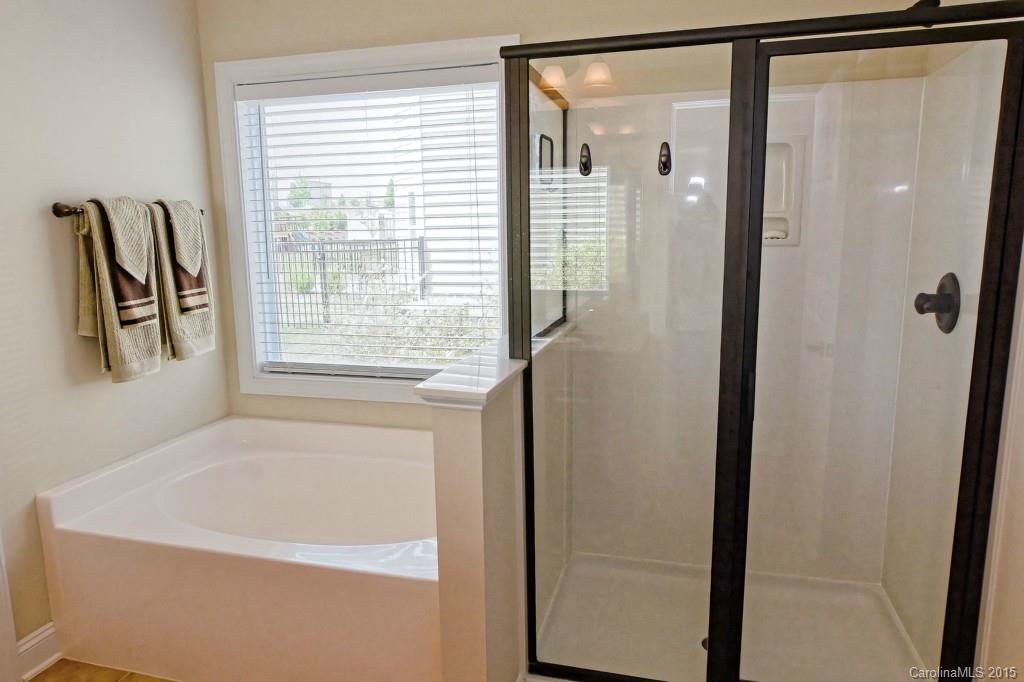 1628 Ridgehaven Road Waxhaw, NC 28173 - Photo 13 of 24 a bathroom with a bathtub and a shower