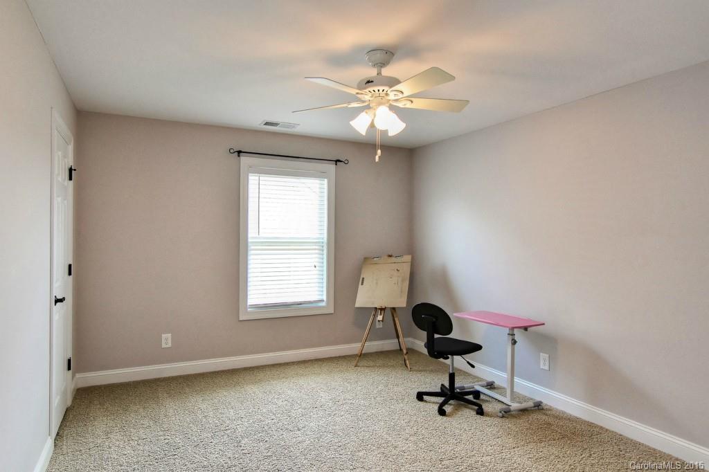 1628 Ridgehaven Road Waxhaw, NC 28173 - Photo 17 of 24 a view of a workspace with furniture and a window