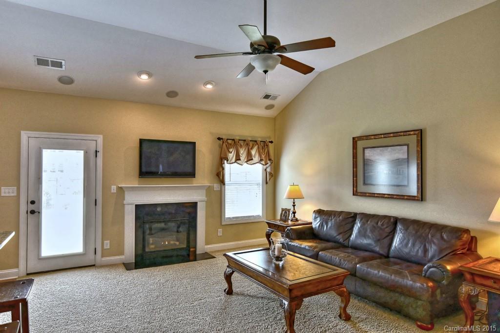 1628 Ridgehaven Road Waxhaw, NC 28173 - Photo 6 of 24 a living room with furniture and a fireplace