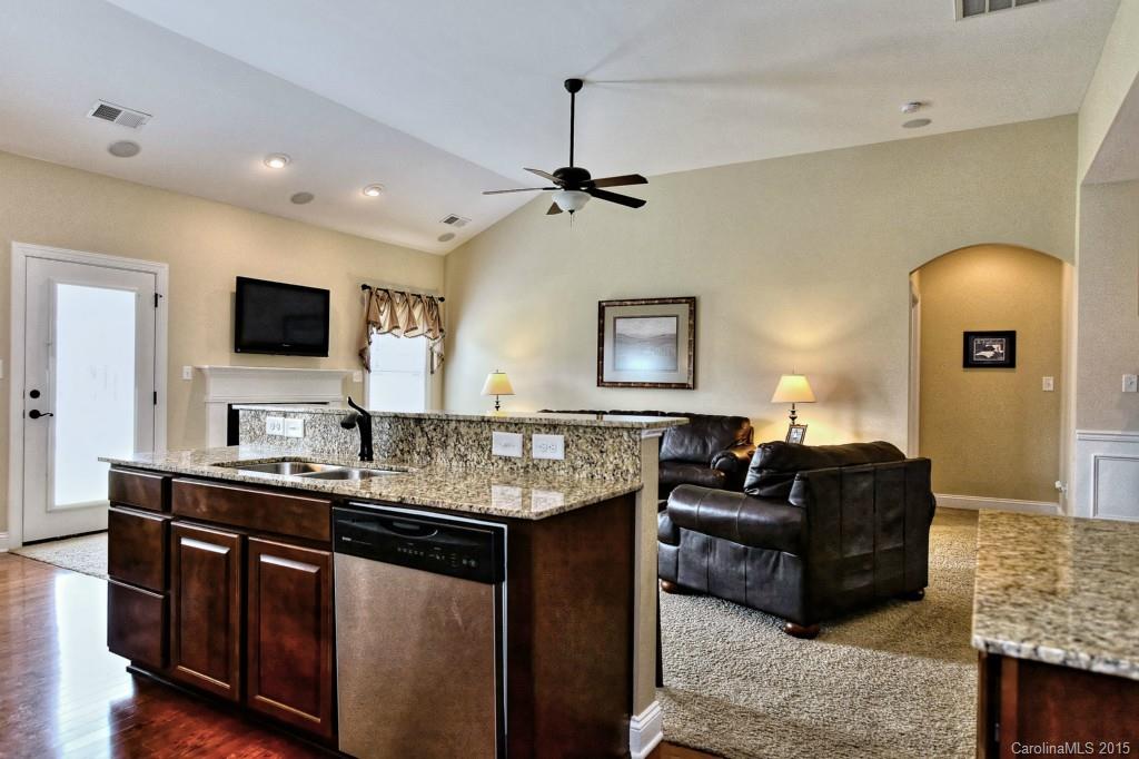 1628 Ridgehaven Road Waxhaw, NC 28173 - Photo 9 of 24 a living room with granite countertop furniture and a flat screen tv