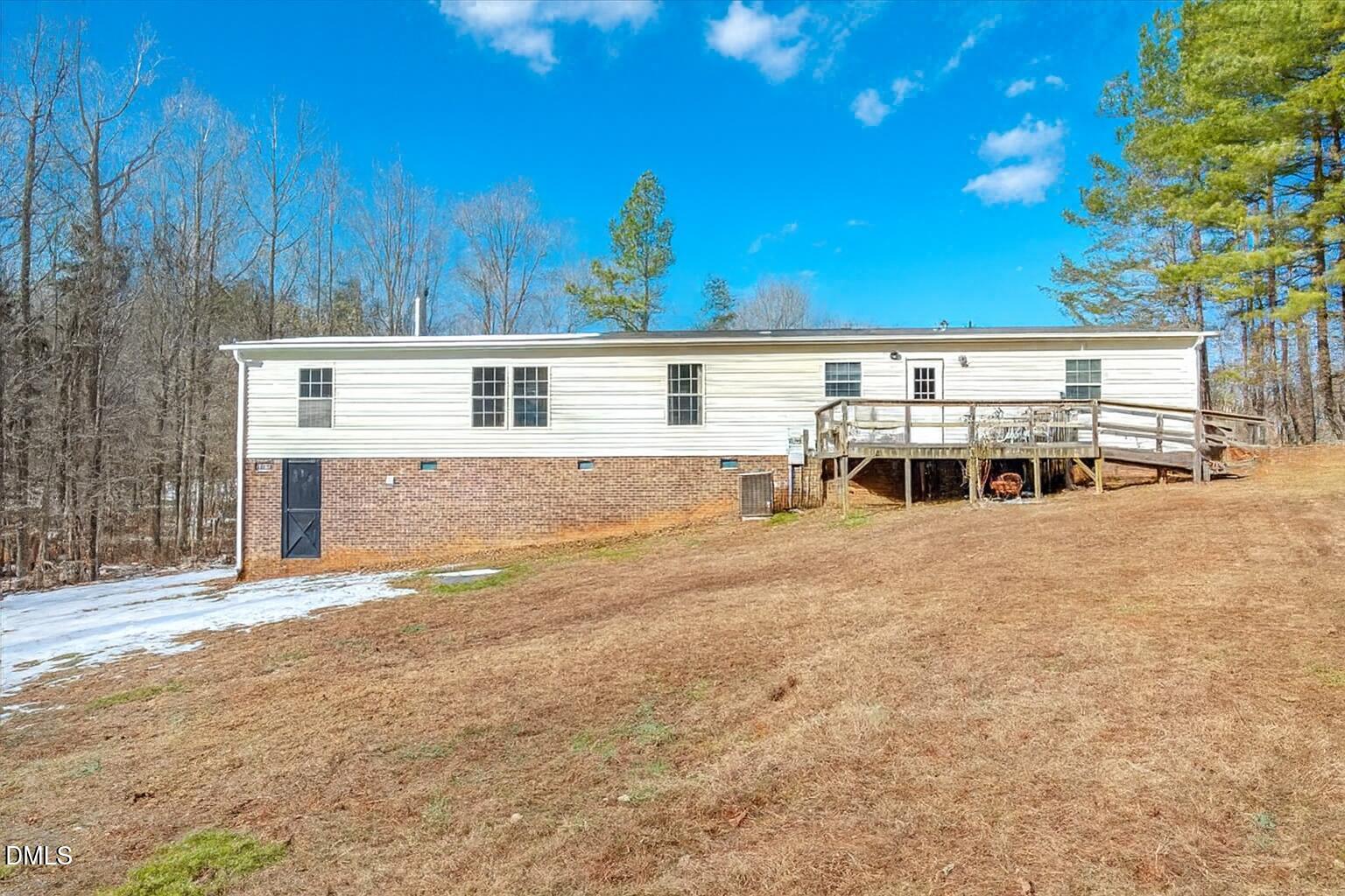 200 Griesch Road Roxboro, NC 27574 - Photo 20 of 22 Rear View w/ Deck & Brick Foundation