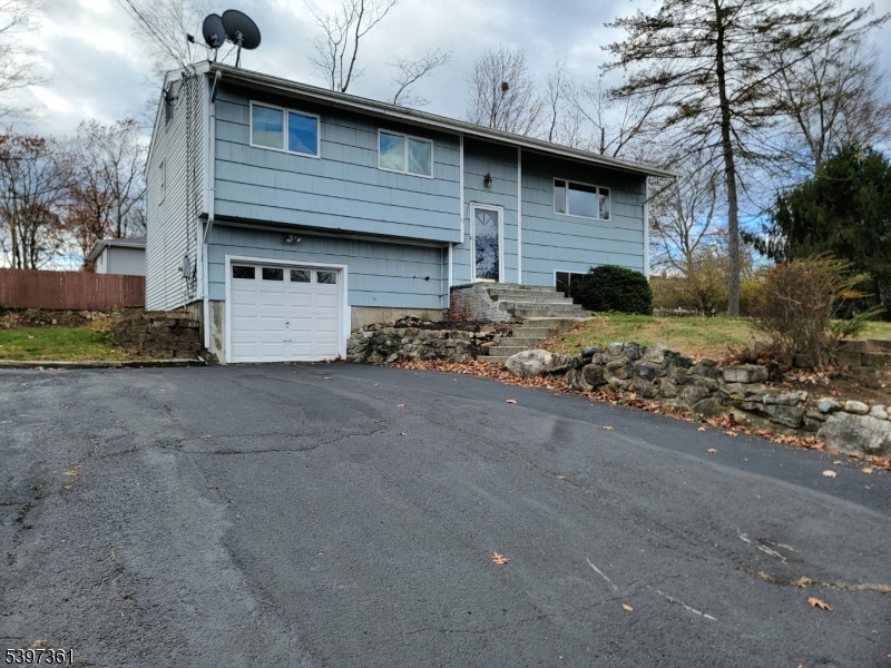 10 Richards Road Hopatcong, NJ 07843 - Photo 1 of 18 a front view of a house with a yard