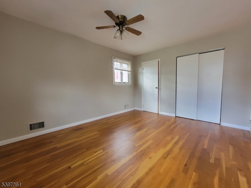 10 Richards Road Hopatcong, NJ 07843 - Photo 11 of 18 a view of empty room with wooden floor