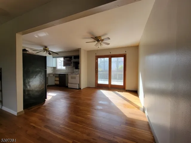 a kitchen with granite countertop a sink and a stove top oven