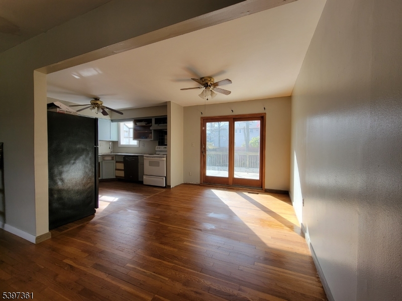 10 Richards Road Hopatcong, NJ 07843 - Photo 6 of 18 a view of an empty room with window and wooden floor