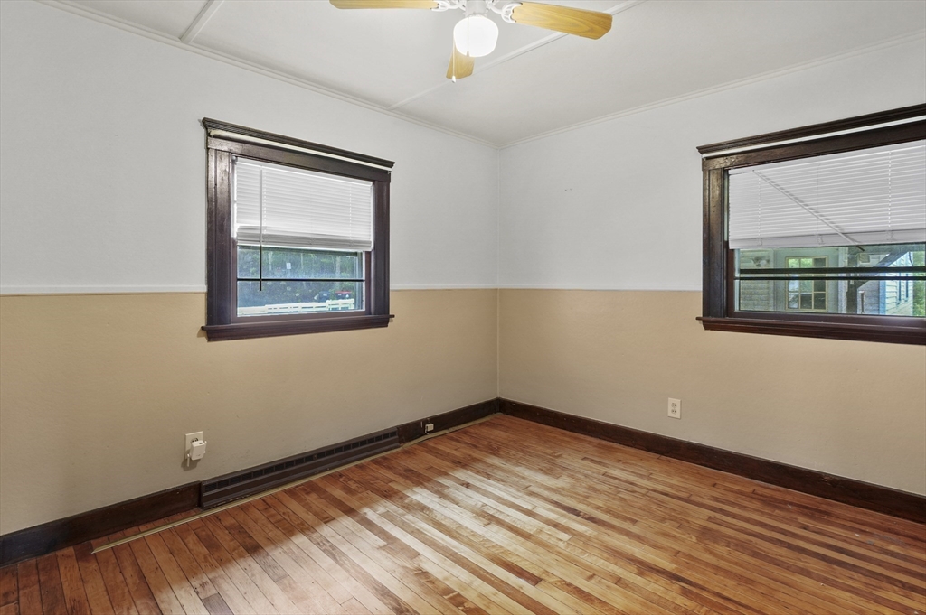 3 Cranberry Meadow Shore Road Charlton, MA 01507 - Photo 15 of 39 a view of empty room with wooden floor and fan