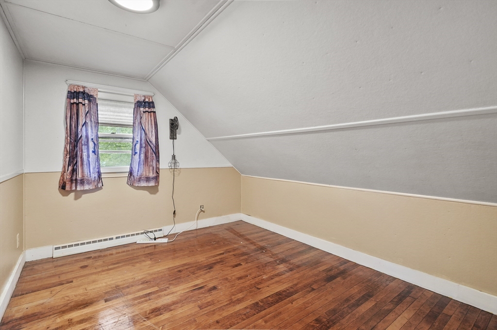 3 Cranberry Meadow Shore Road Charlton, MA 01507 - Photo 18 of 39 a view of an empty room with wooden floor and window