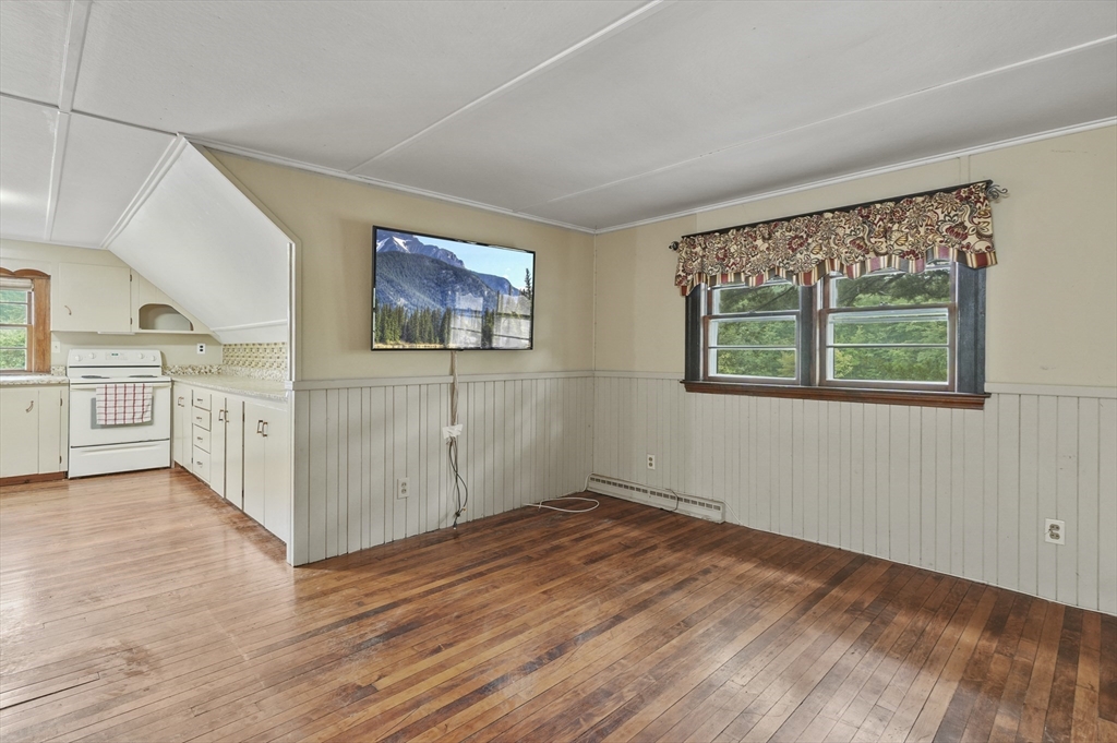 3 Cranberry Meadow Shore Road Charlton, MA 01507 - Photo 20 of 39 wooden floor in an empty room with a window