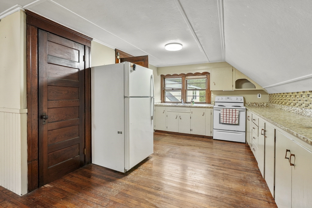3 Cranberry Meadow Shore Road Charlton, MA 01507 - Photo 25 of 39 a view of a kitchen with a refrigerator a sink and dishwasher next to a window