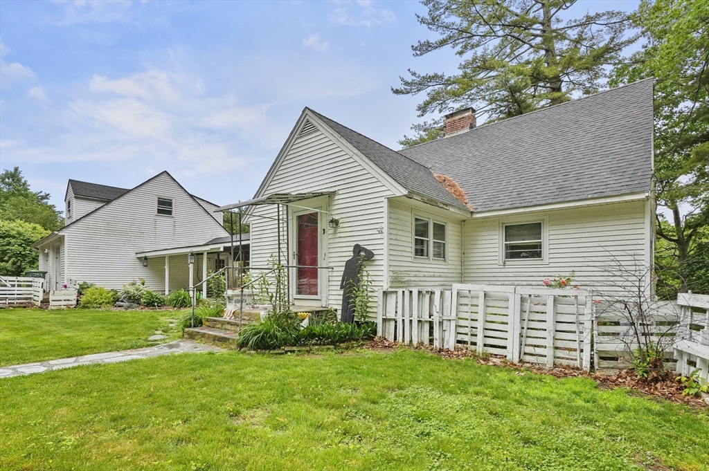 3 Cranberry Meadow Shore Road Charlton, MA 01507 - Photo 3 of 39 a front view of house with yard and green space
