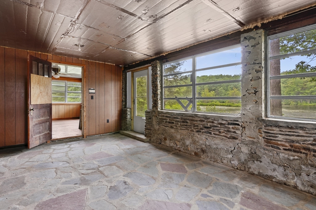 3 Cranberry Meadow Shore Road Charlton, MA 01507 - Photo 32 of 39 a view of an empty room with a window