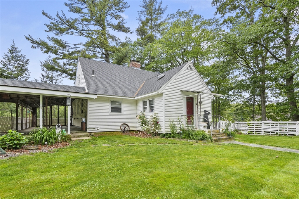 3 Cranberry Meadow Shore Road Charlton, MA 01507 - Photo 4 of 39 a front view of house with yard and green space
