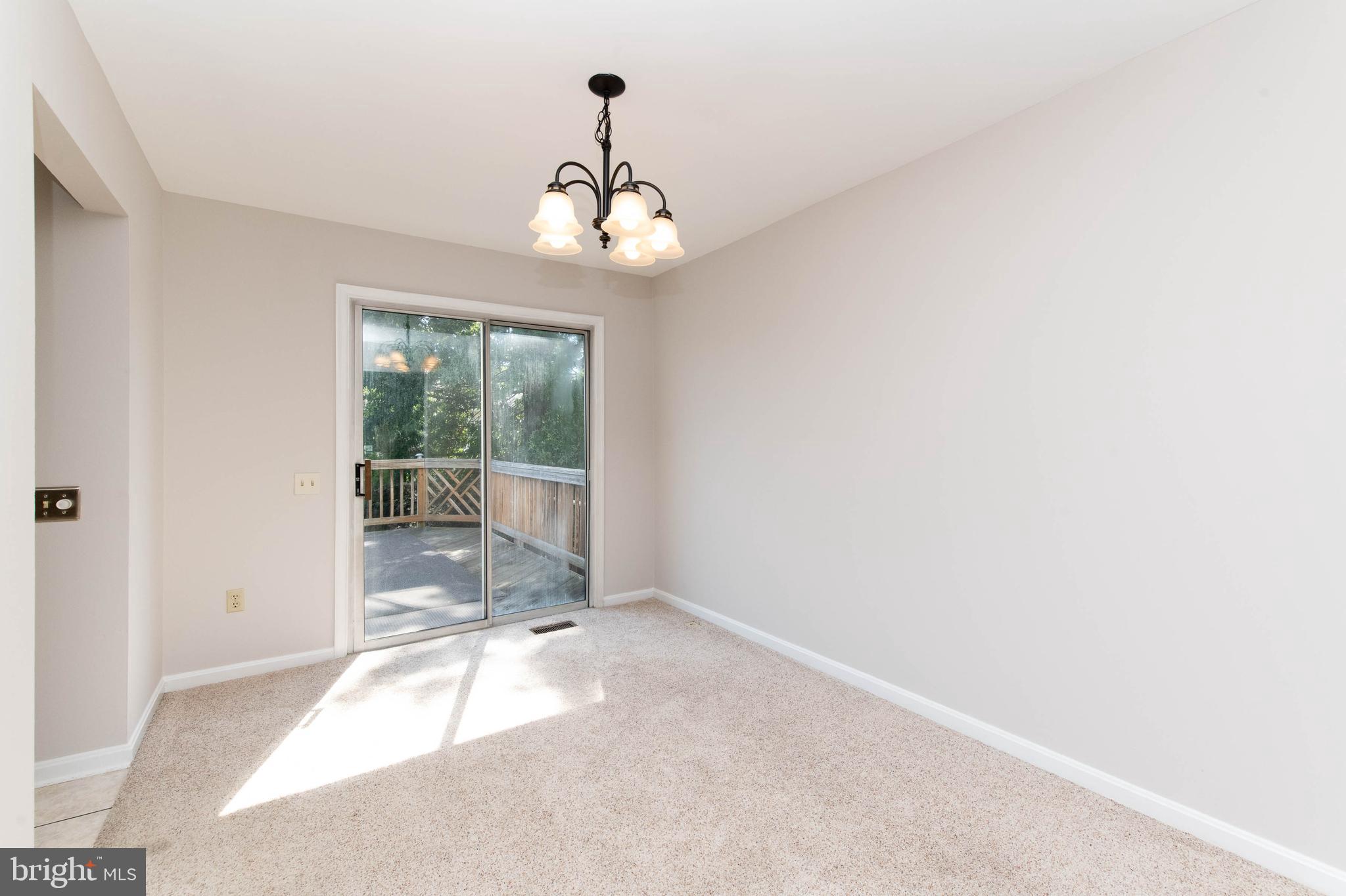 4403 Cole Farm Road Baltimore, MD 21236 - Photo 9 of 30 a view of a livingroom with a floor to ceiling window