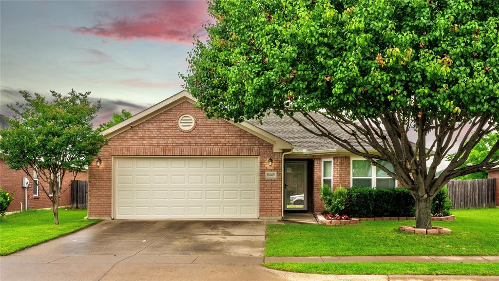 8449 Trinity Vista Trail Fort Worth, TX 76053 - Photo 1 of 1 a front view of a house with a yard and garage
