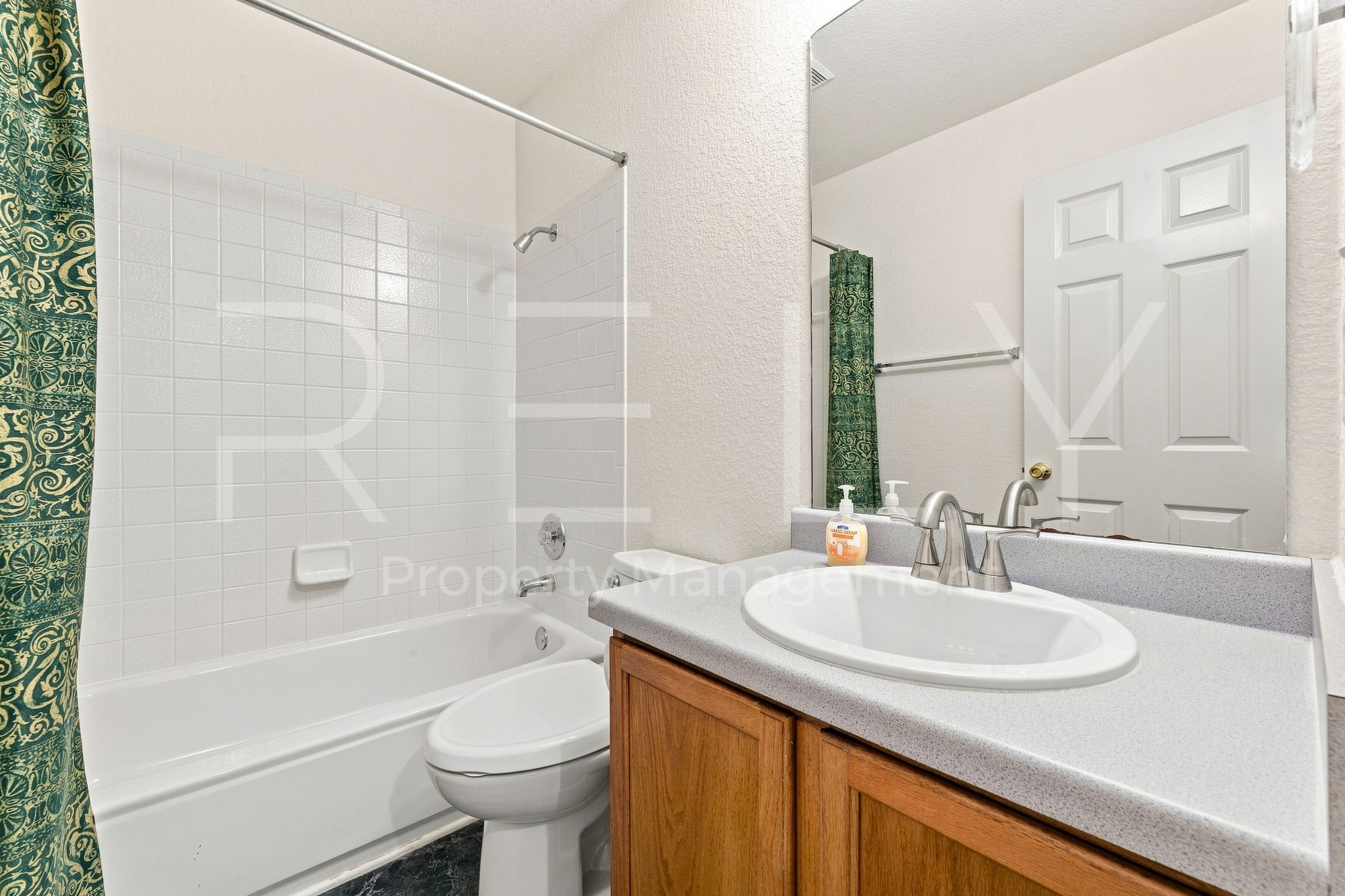 103 Prairie Springs Loop Georgetown, TX 78626 - Photo 19 of 33 A well-appointed bathroom features a bathtub-shower combination with classic tile surround.