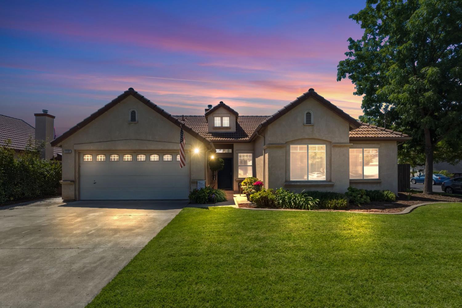 1757 Homestead Way Lemoore, CA 93245 - Photo 1 of 35 a front view of a house with a yard