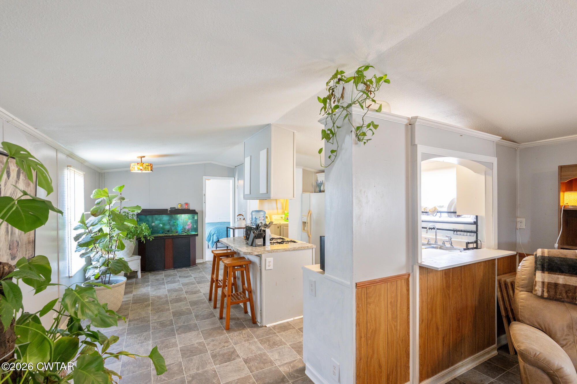 21 Deercrest Lane Lexington, TN 38351 - Photo 7 of 24 a living room with furniture a flower pot and a dining table