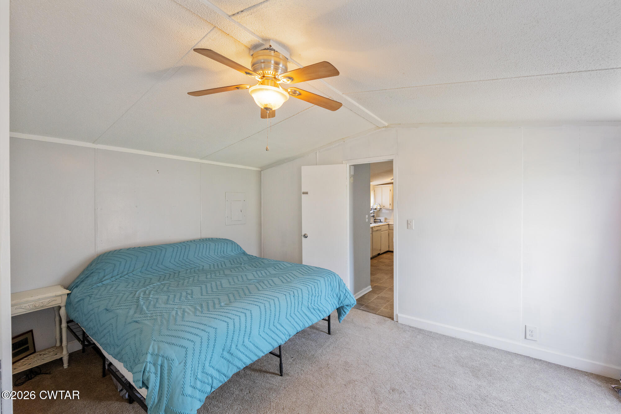 21 Deercrest Lane Lexington, TN 38351 - Photo 10 of 24 a bedroom with a bed and a chandelier