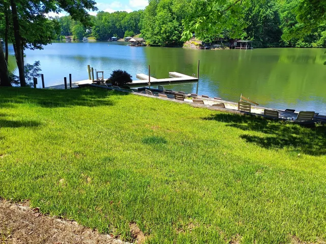 a view of a lake with houses in the background