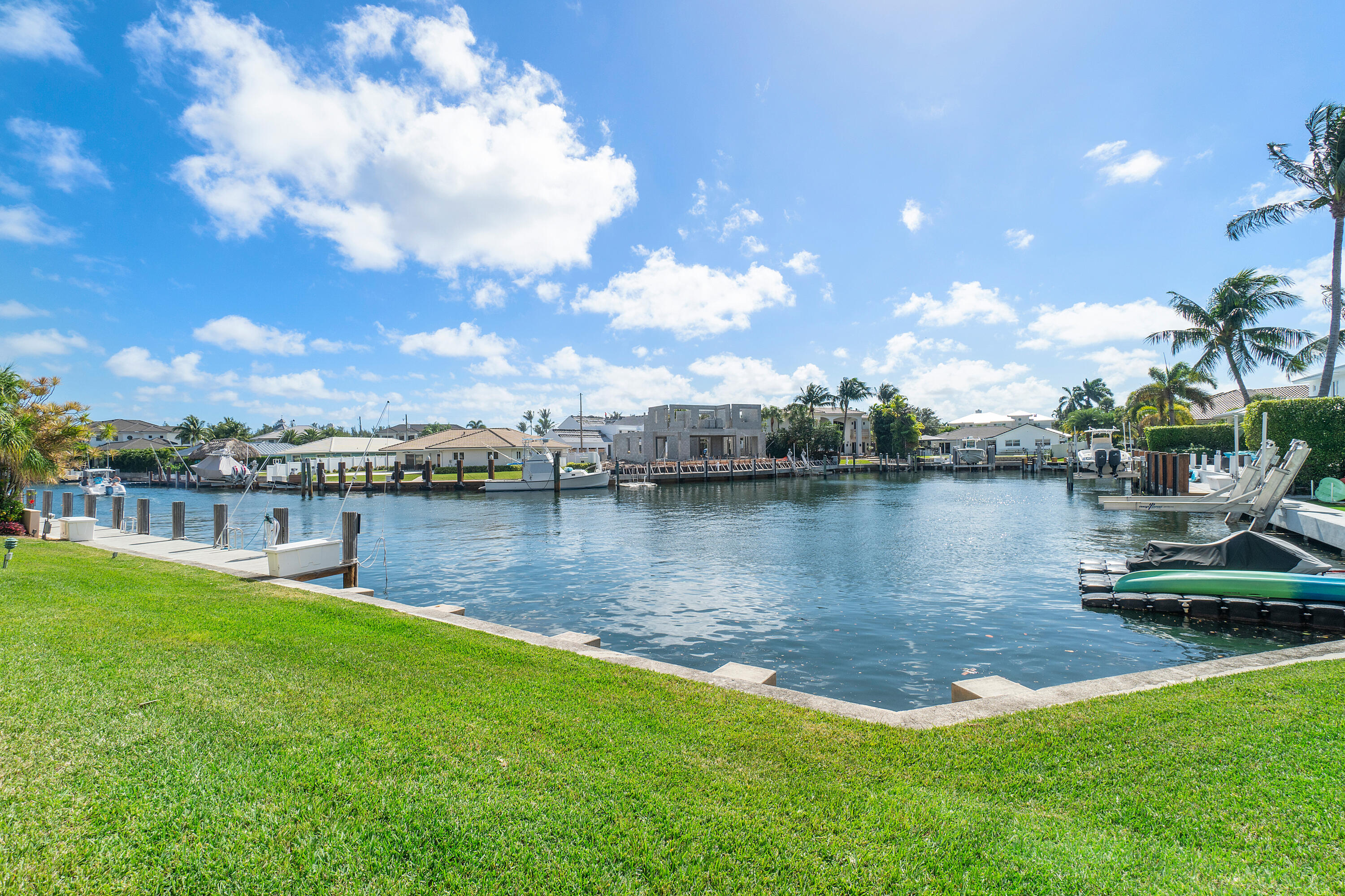698 Northeast Spanish River Boulevard, Unit 140 Boca Raton, FL 33431 - Photo 13 of 21 a view of a lake with houses