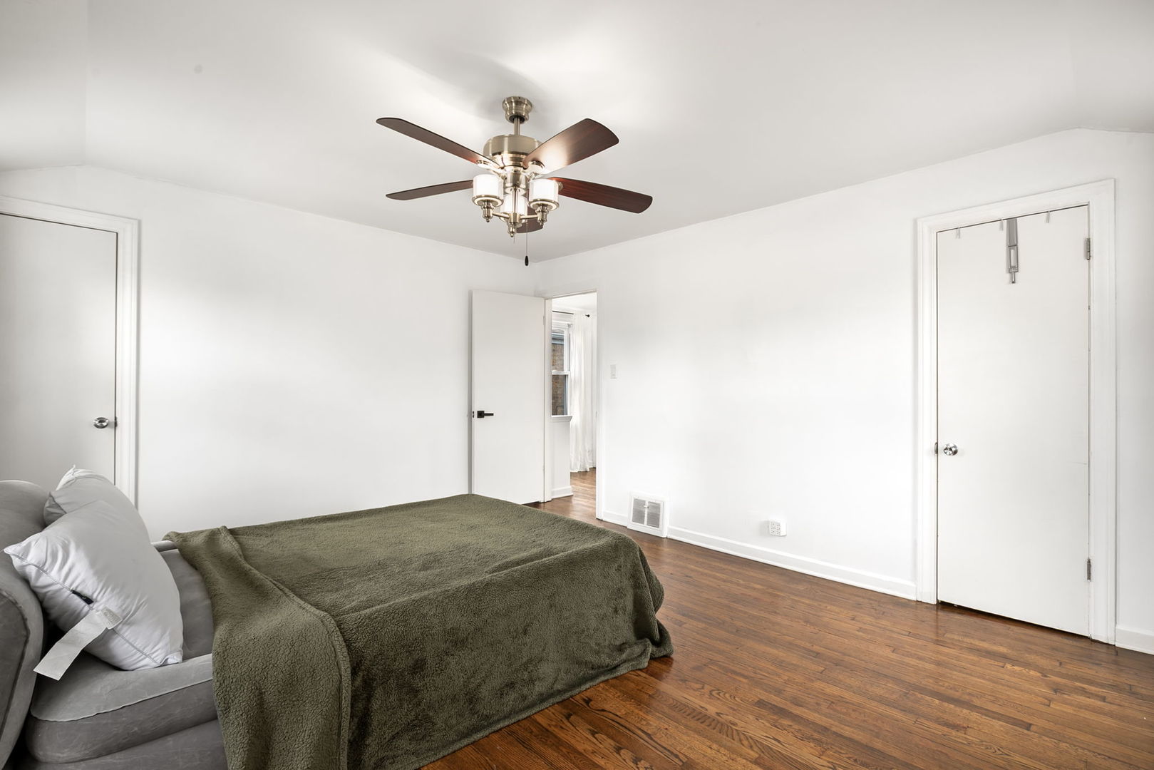 4237 Park Avenue Brookfield, IL 60513 - Photo 11 of 20 a bedroom with a bed and wooden floor