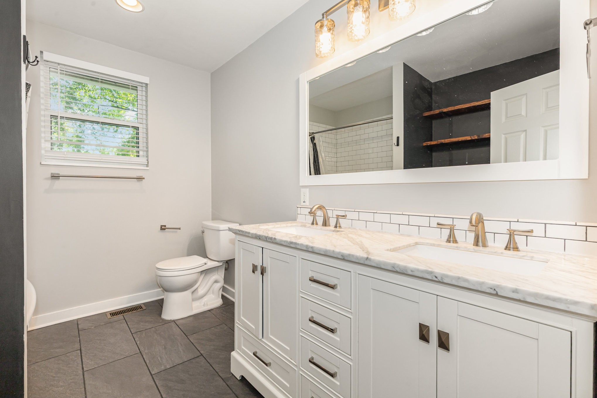 118 Brevet Drive Franklin, TN 37064 - Photo 12 of 18 a bathroom with a granite countertop toilet sink and mirror