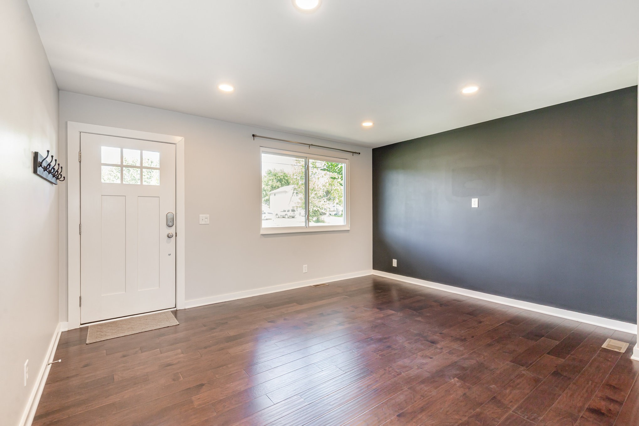 118 Brevet Drive Franklin, TN 37064 - Photo 4 of 18 a view of an empty room with wooden floor and a window