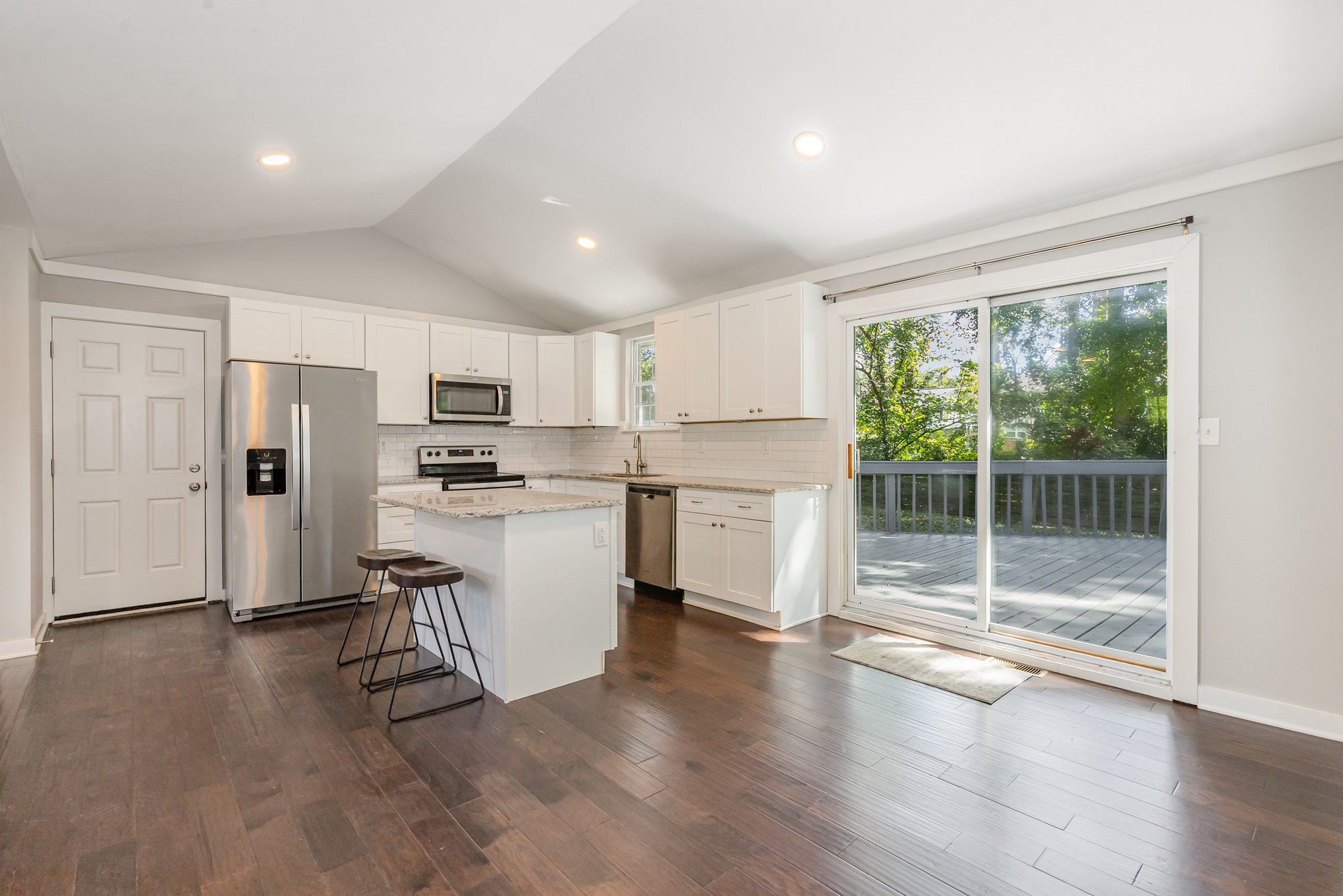 118 Brevet Drive Franklin, TN 37064 - Photo 7 of 18 a kitchen with white cabinets and stainless steel appliances