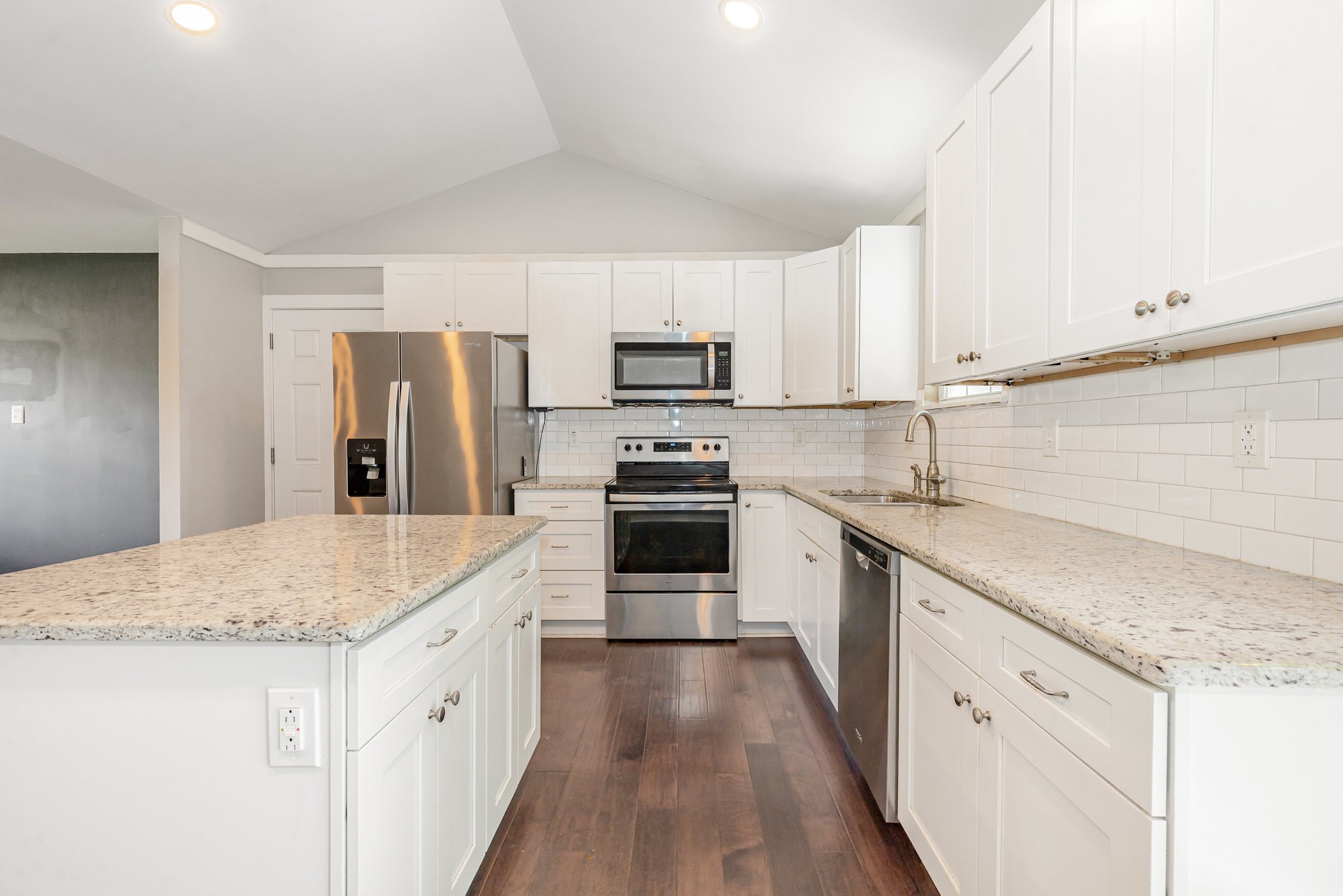 118 Brevet Drive Franklin, TN 37064 - Photo 8 of 18 a kitchen with granite countertop a stove sink and refrigerator