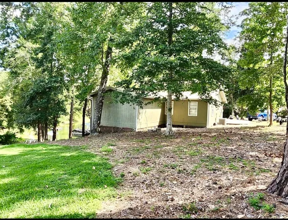 a view of a wooden deck and a backyard