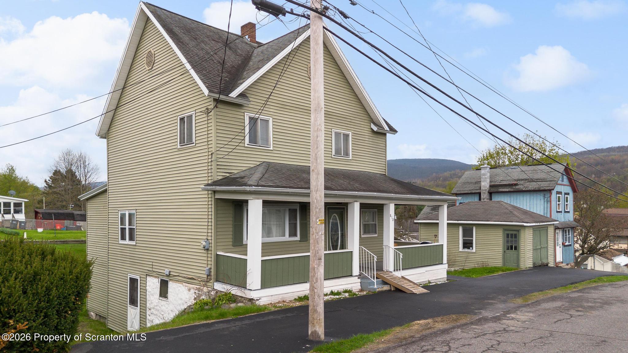 810 Pine Street Mayfield, PA 18433 - Photo 1 of 37 a view of a house with a yard and sitting space