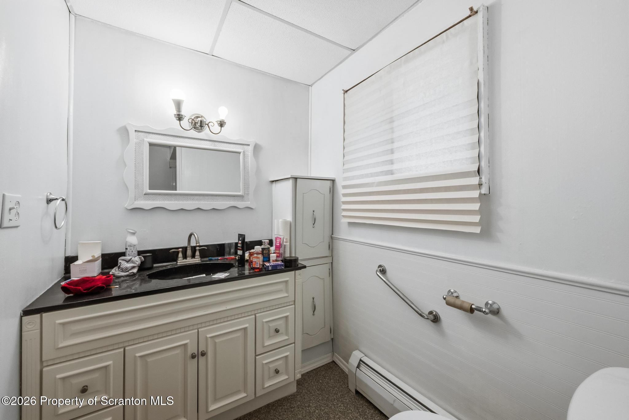 810 Pine Street Mayfield, PA 18433 - Photo 15 of 37 a bathroom with a sink and a mirror