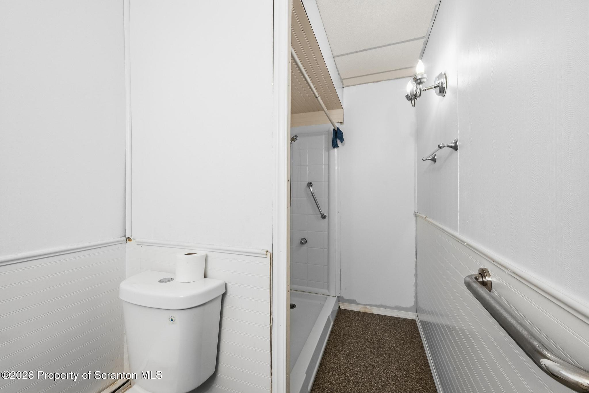 810 Pine Street Mayfield, PA 18433 - Photo 16 of 37 a bathroom with a sink a toilet and shower
