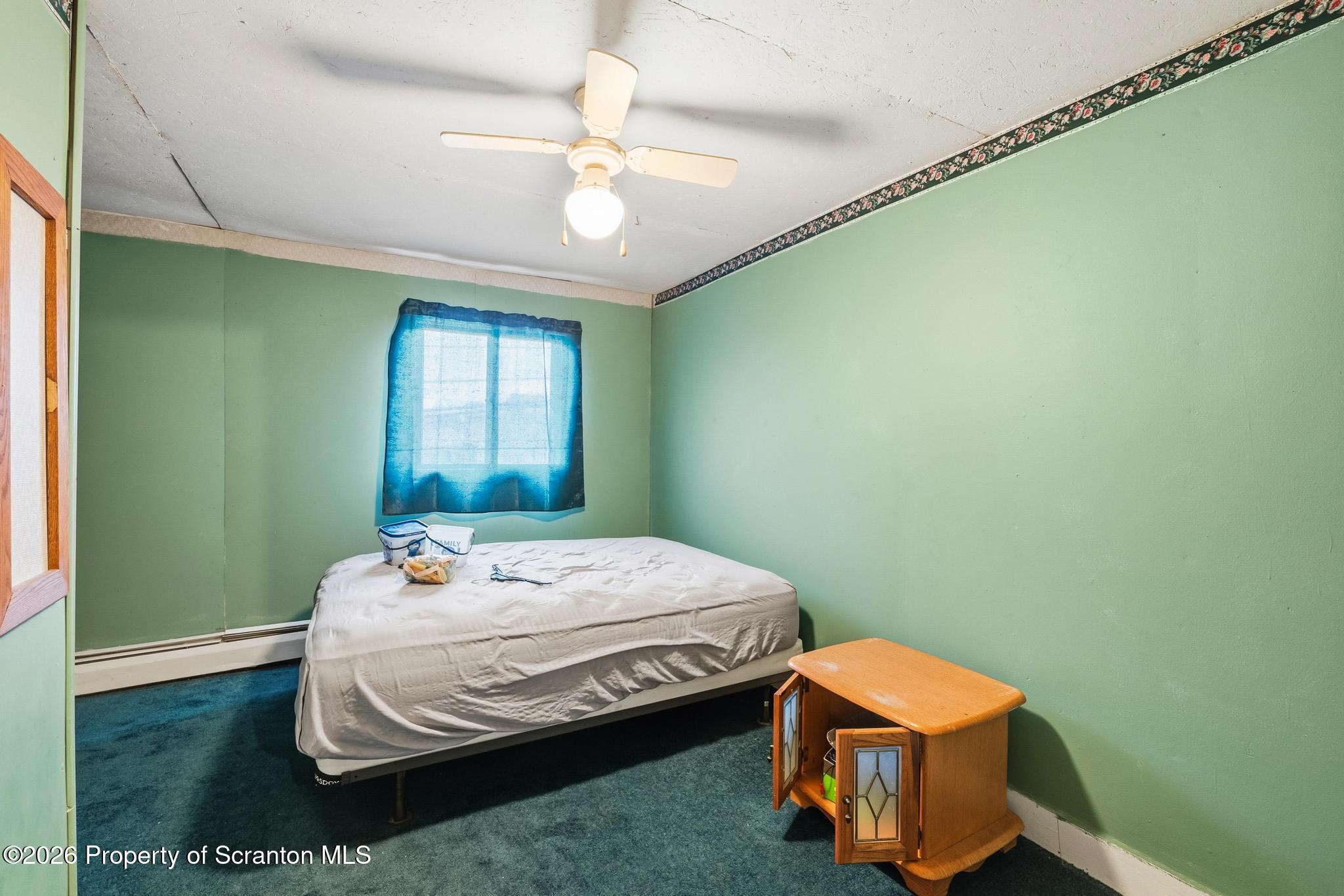 810 Pine Street Mayfield, PA 18433 - Photo 24 of 37 a bedroom with a bed and a window